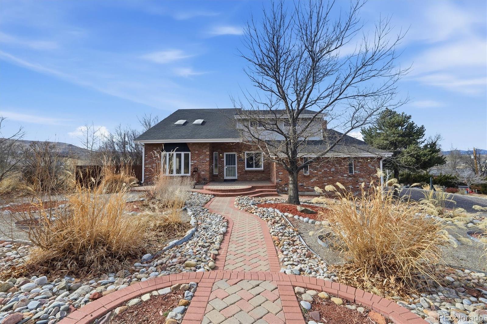 767 Ellis Street Golden, CO 80401 - Photo 2 of 50 a front view of a house with a yard covered in snow