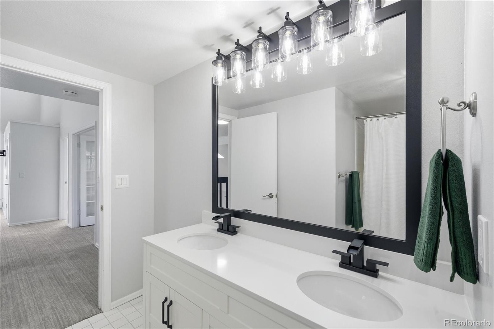 767 Ellis Street Golden, CO 80401 - Photo 31 of 50 a bathroom with a sink vanity and a mirror