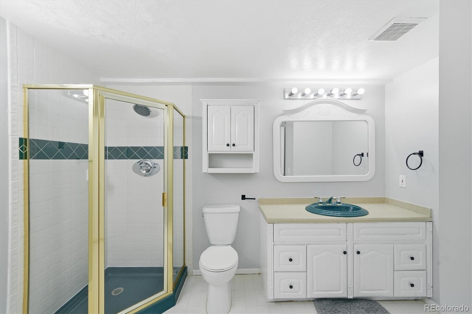 767 Ellis Street Golden, CO 80401 - Photo 36 of 50 a bathroom with a granite countertop sink toilet and shower