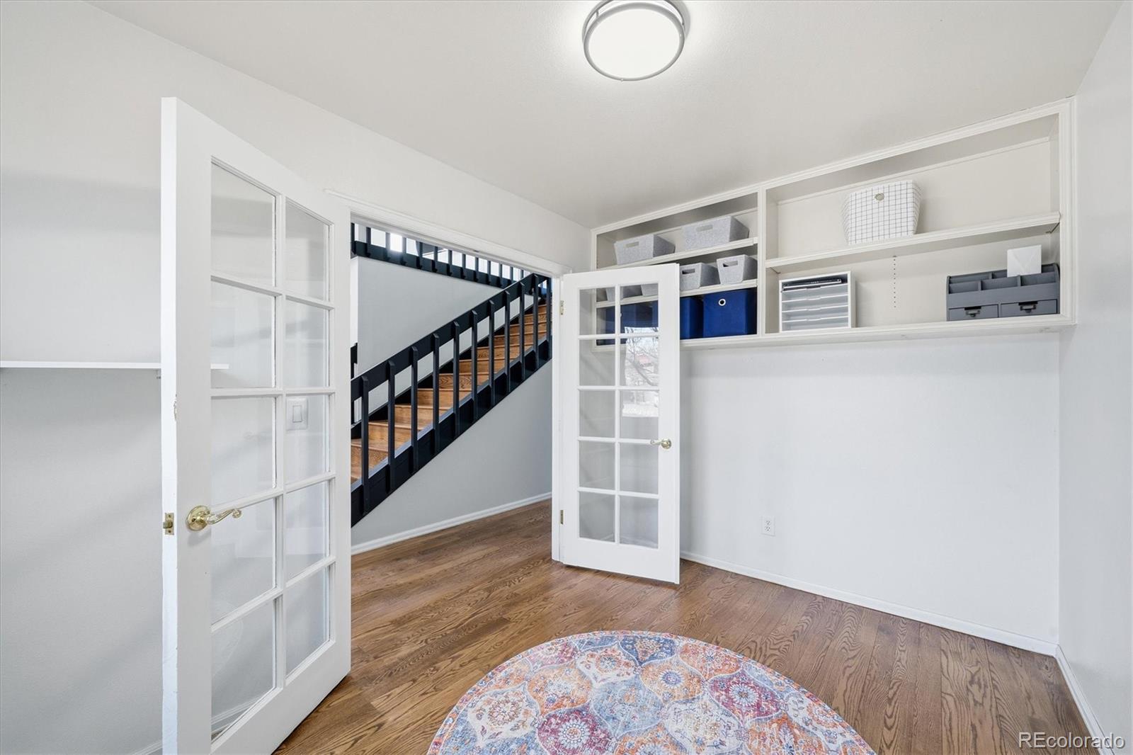 767 Ellis Street Golden, CO 80401 - Photo 5 of 50 a view of entryway with stairs and wooden floor