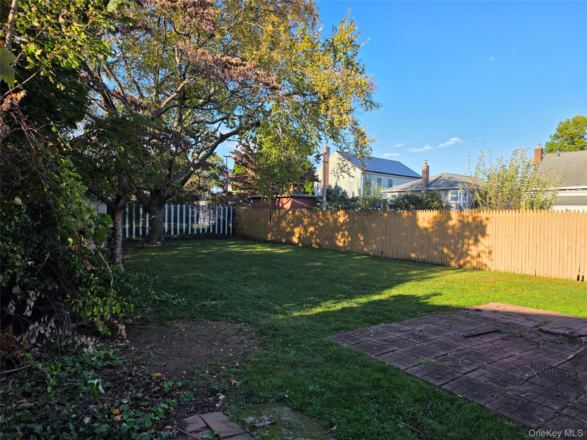 220 Raff Avenue Mineola, NY 11501 - Photo 22 of 22 Fenced backyard featuring a patio area
