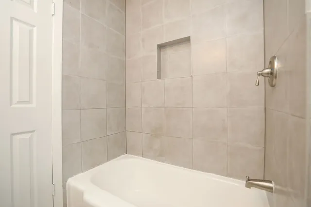 a bathroom with a white bath tub