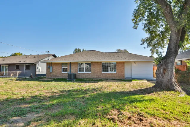 a view of a house with a big yard