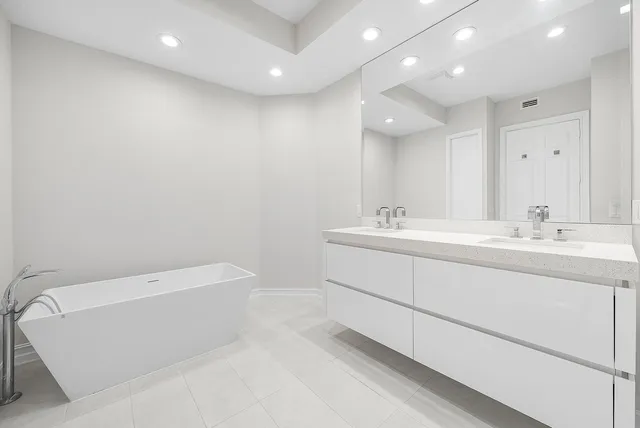 a bathroom with a sink a toilet and a bathtub