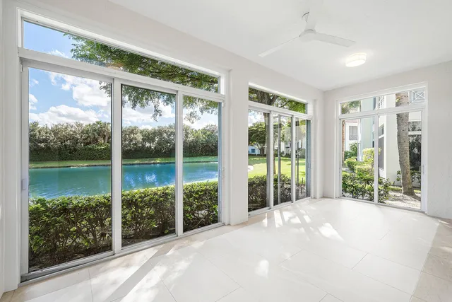a view of an empty room with windows