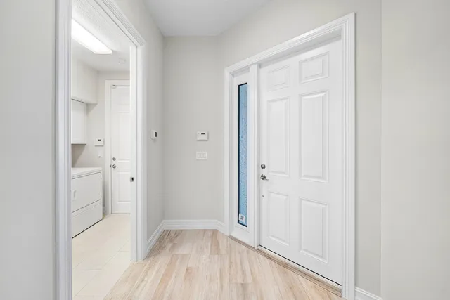 a view of a kitchen with sink and cabinets