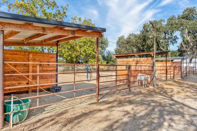 a view of a backyard with a iron fence