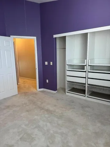 a view of an empty room with a fireplace