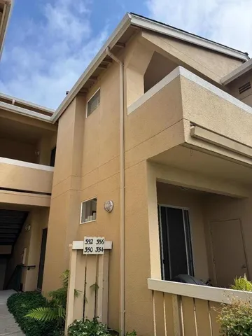 a kitchen with granite countertop a sink and stainless steel appliances