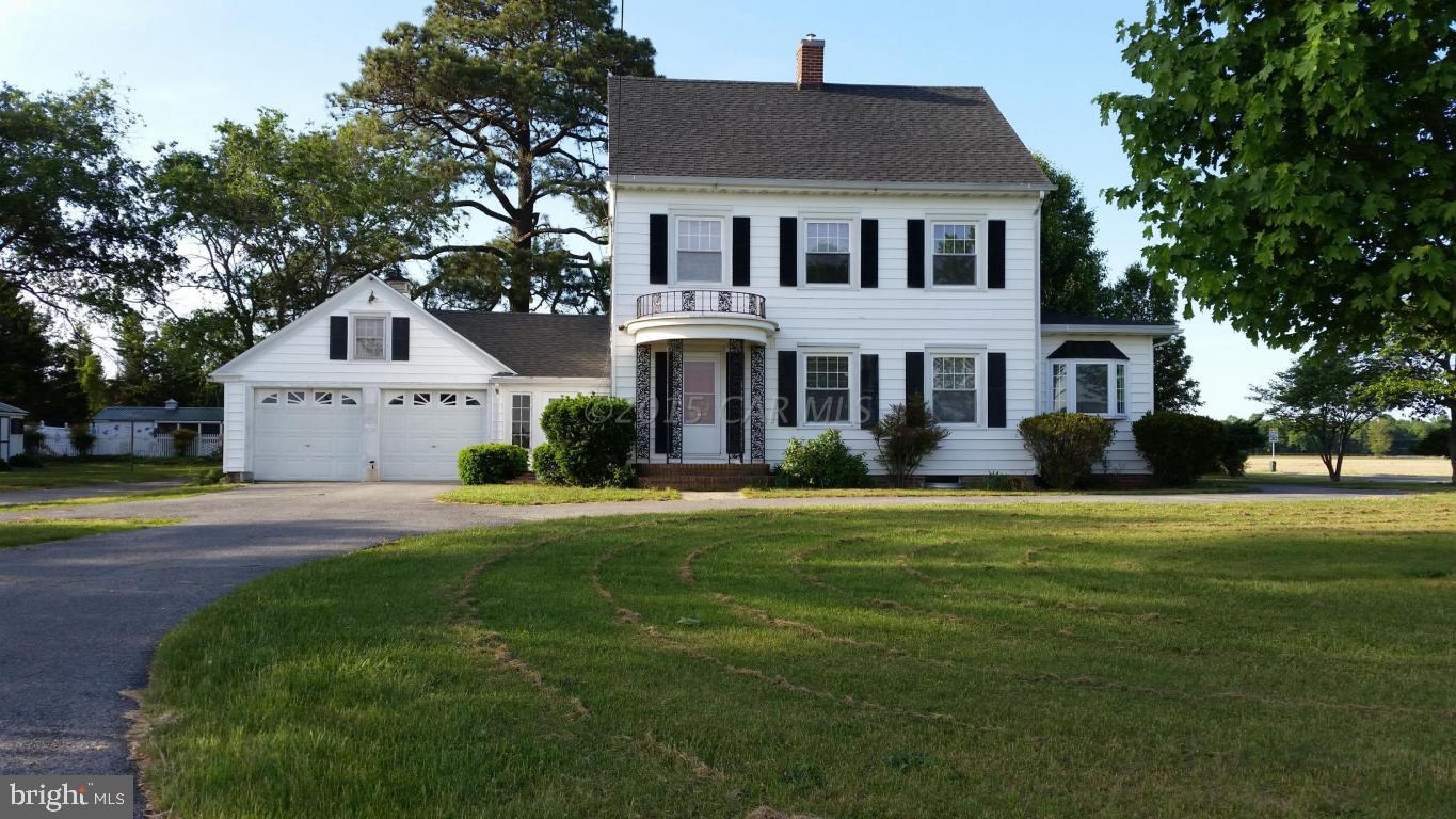 36142 Richland Road Willards, MD 21874 - Photo 1 of 11 a front view of a house with a garden