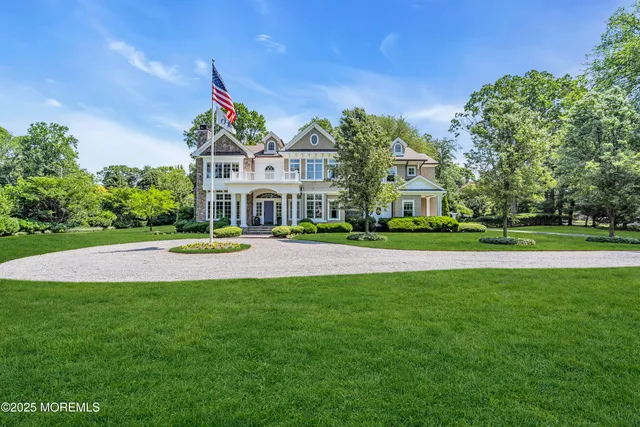a living room with fireplace furniture and a wooden floor