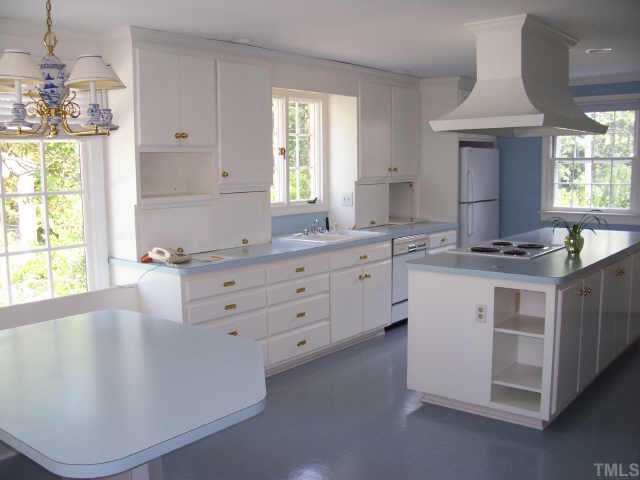 2129 Coley Forest Place Raleigh, NC 27607 - Photo 4 of 10 Kitchen with center island and walk-in pantry