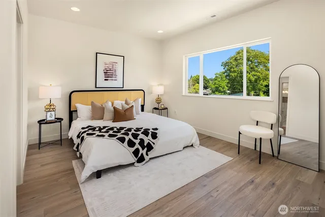 a bedroom with a large bed and a window