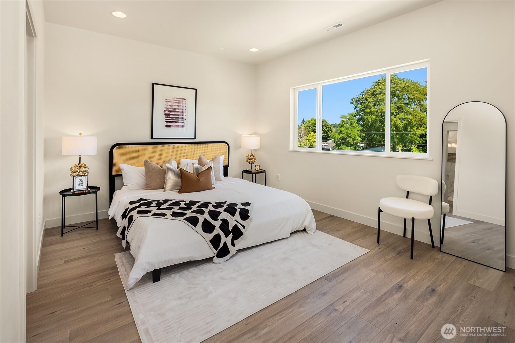 6618 52nd Avenue West University Place, WA 98467 - Photo 13 of 26 a bedroom with a large bed and a window
