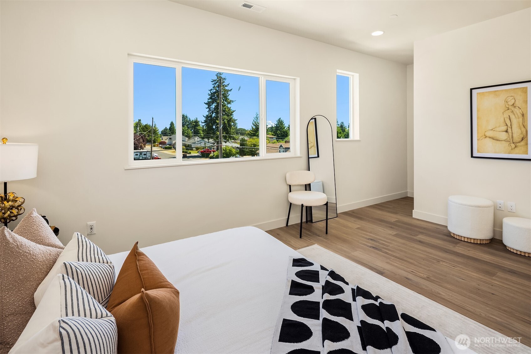6618 52nd Avenue West University Place, WA 98467 - Photo 15 of 26 a bedroom with a bed and wooden floor