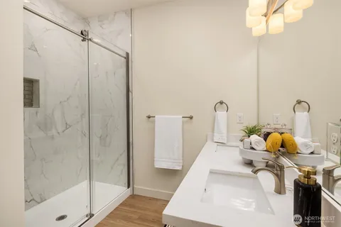 a bathroom with a sink and shower