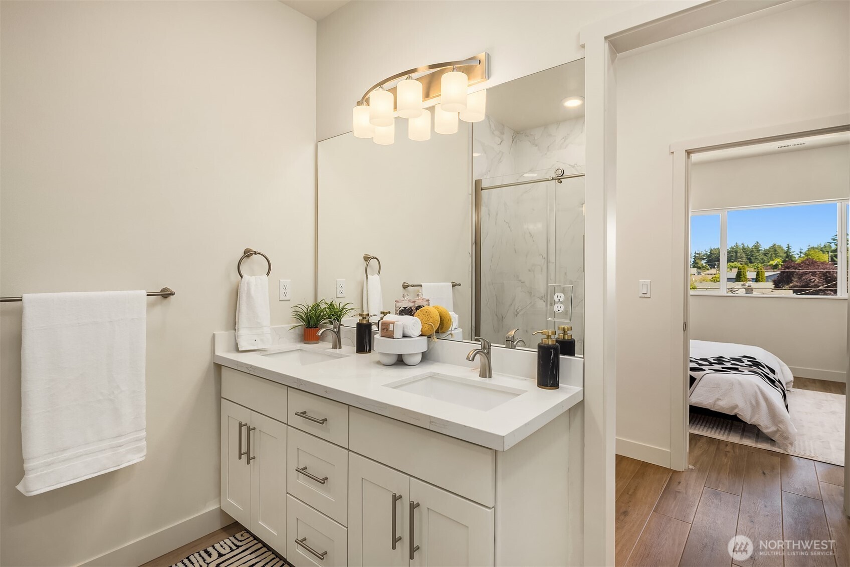 6618 52nd Avenue West University Place, WA 98467 - Photo 17 of 26 a bathroom with a double vanity sink mirror and shower