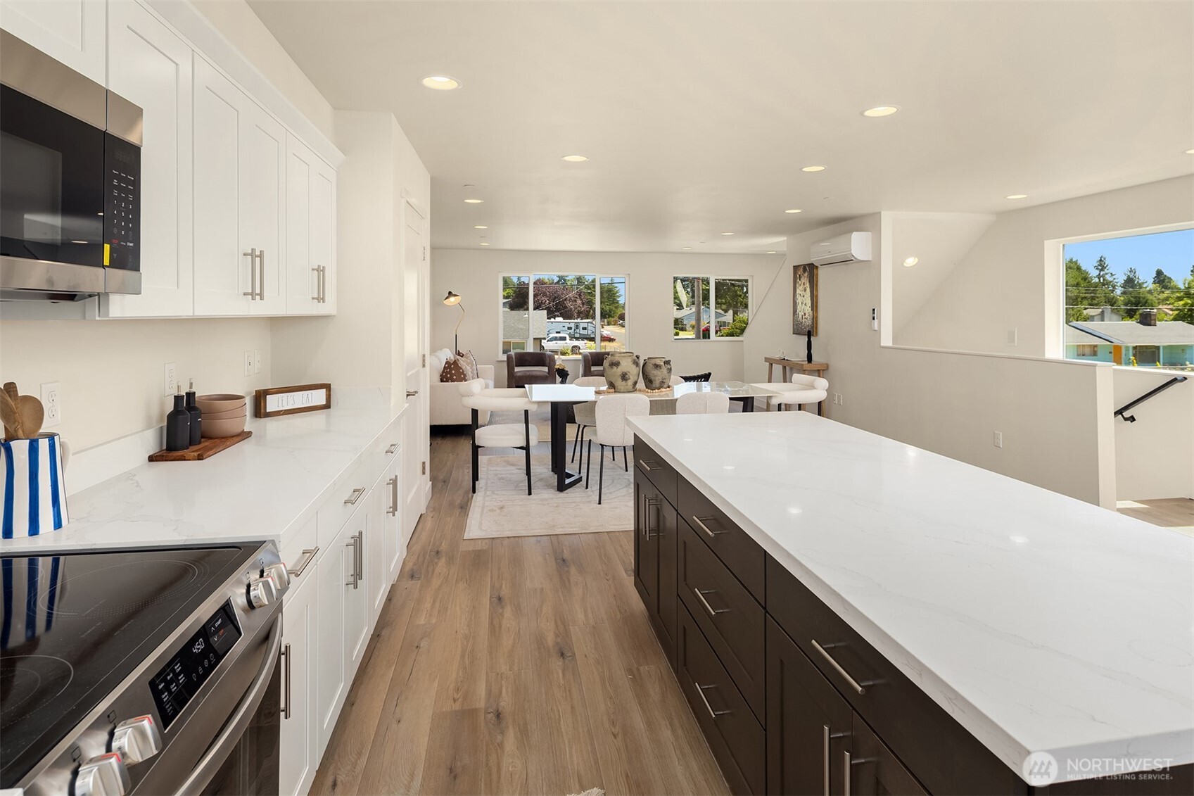6618 52nd Avenue West University Place, WA 98467 - Photo 4 of 26 a kitchen with lots of counter top space and wooden floor