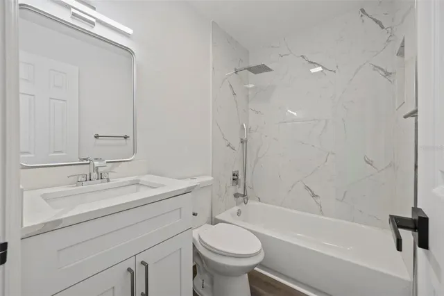 a bathroom with a sink a toilet and a bathtub