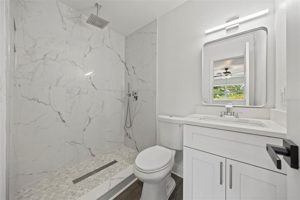 5317 Curry Ford Road, Unit 203 BLDG L Orlando, FL 32812 - Photo 5 of 18 a bathroom with a sink toilet and shower