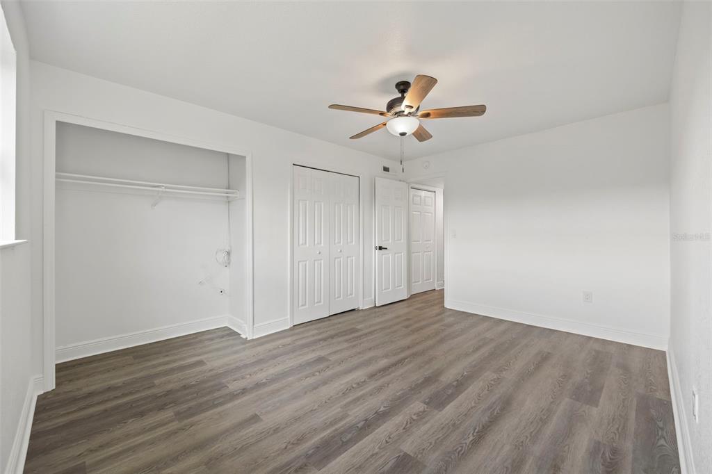 5317 Curry Ford Road, Unit 203 BLDG L Orlando, FL 32812 - Photo 10 of 18 a view of an empty room and wooden floor