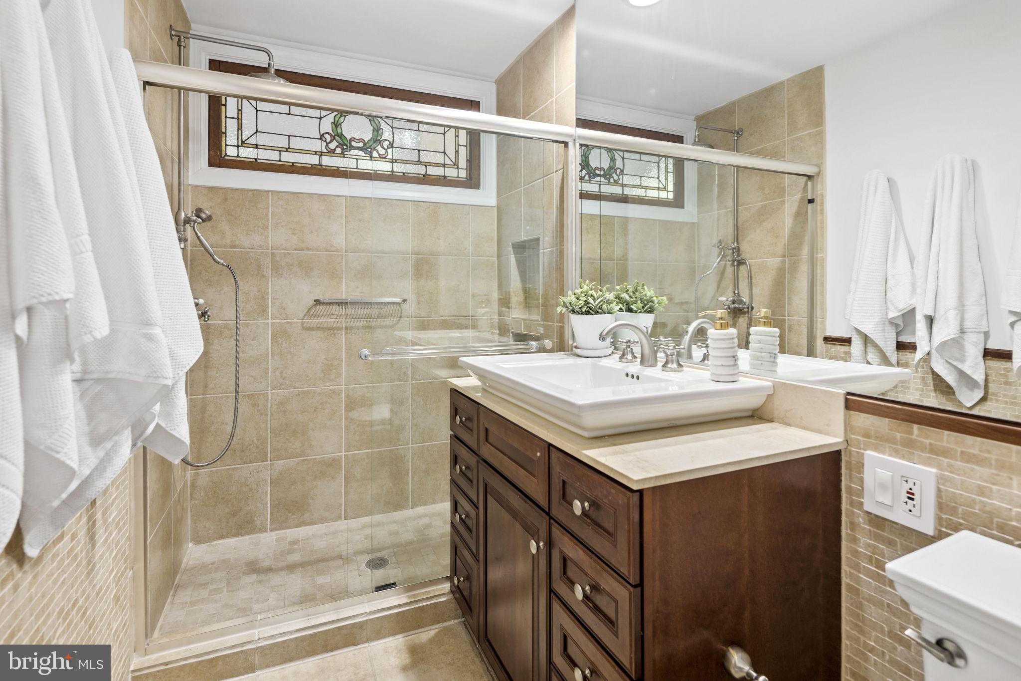1820 Kalorama Road Northwest, Unit 1 Washington, DC 20009 - Photo 13 of 41 Walk-in shower and vanity