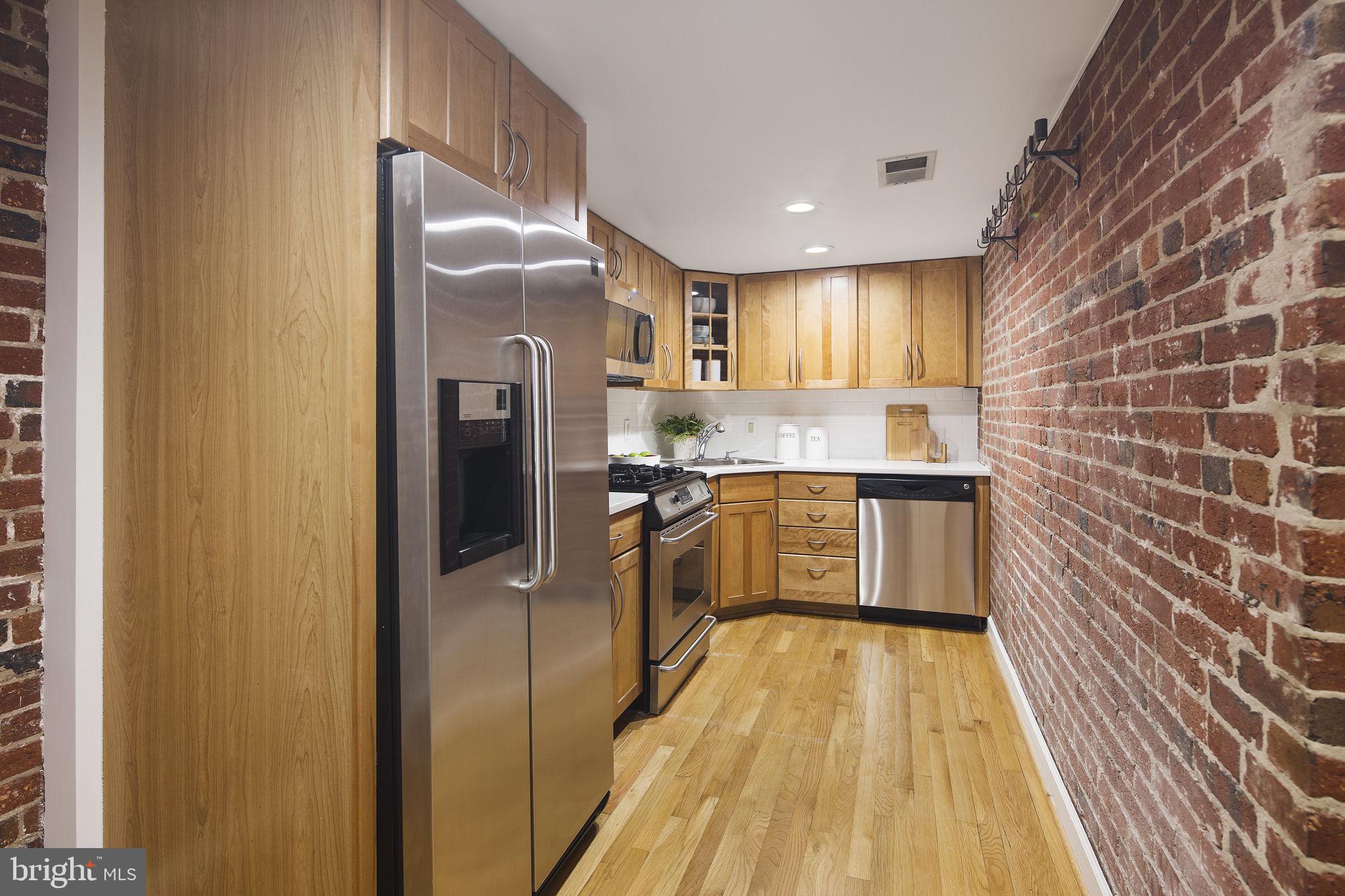 1820 Kalorama Road Northwest, Unit 1 Washington, DC 20009 - Photo 28 of 41 Exposed brick wall