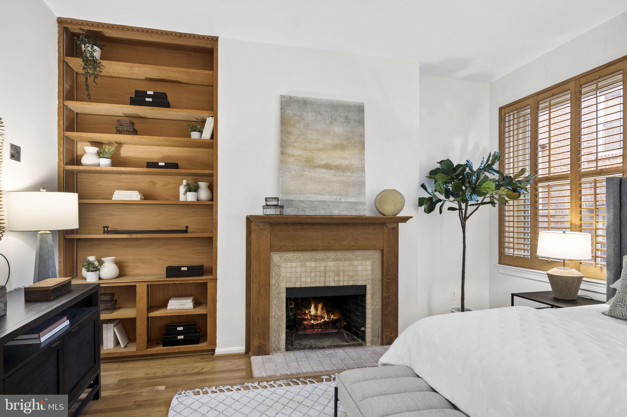 1820 Kalorama Road Northwest, Unit 1 Washington, DC 20009 - Photo 8 of 41 Builtin bookcase & fireplace