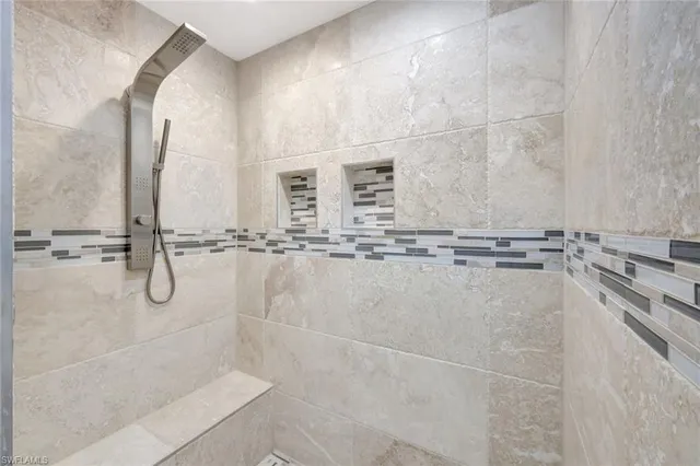 a bathroom with a shower and a sink