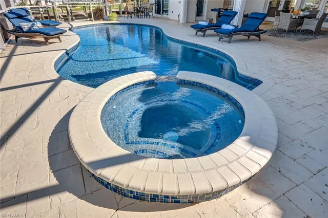 a view of a swimming pool with a sitting area