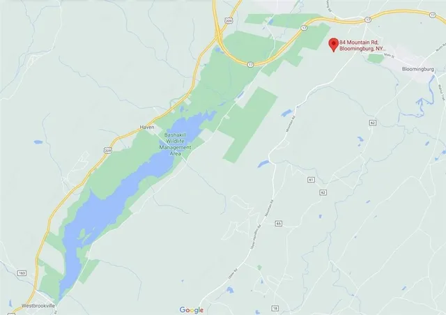 a white bath tub sitting next to a white bed