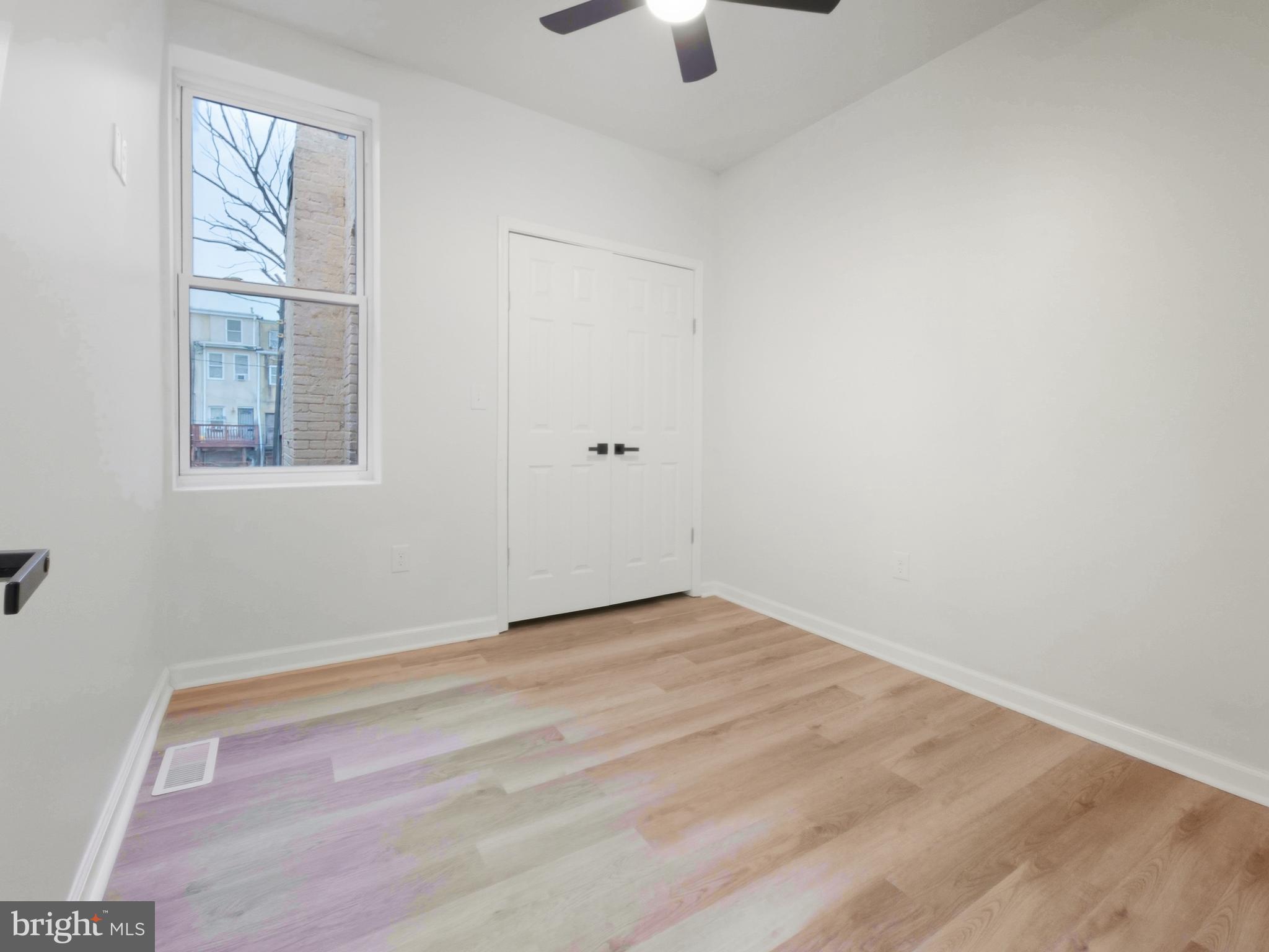 2321 McCulloh Street Baltimore, MD 21217 - Photo 19 of 29 an empty room with windows