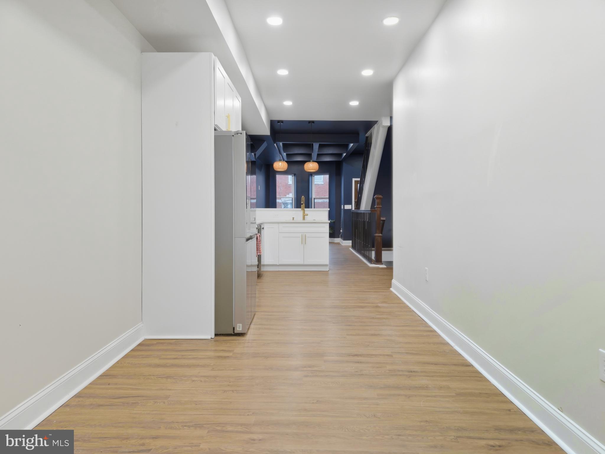 2321 McCulloh Street Baltimore, MD 21217 - Photo 7 of 29 a view of a hallway with wooden floor and furniture