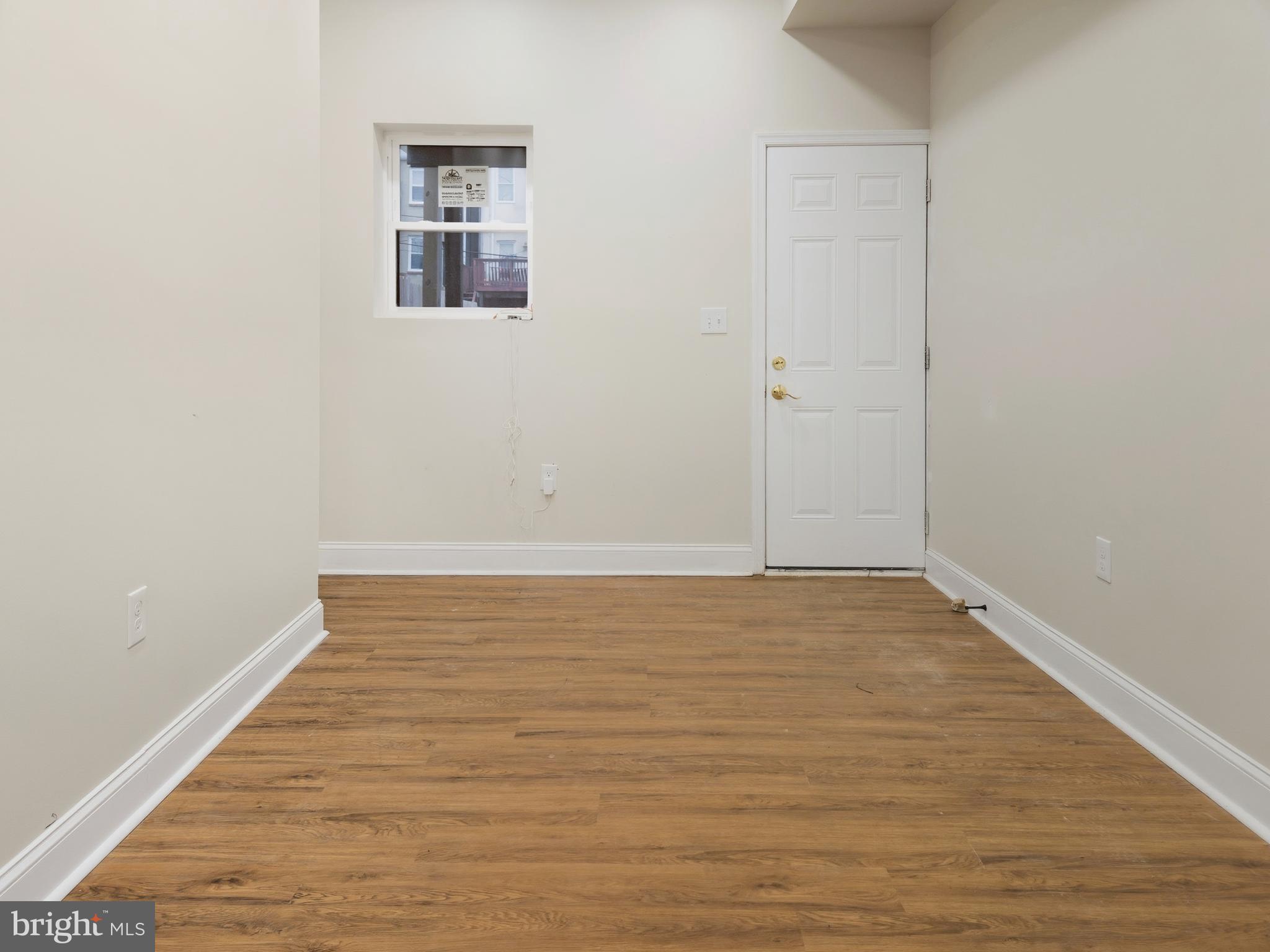 2321 McCulloh Street Baltimore, MD 21217 - Photo 8 of 29 a view of an empty room with wooden floor
