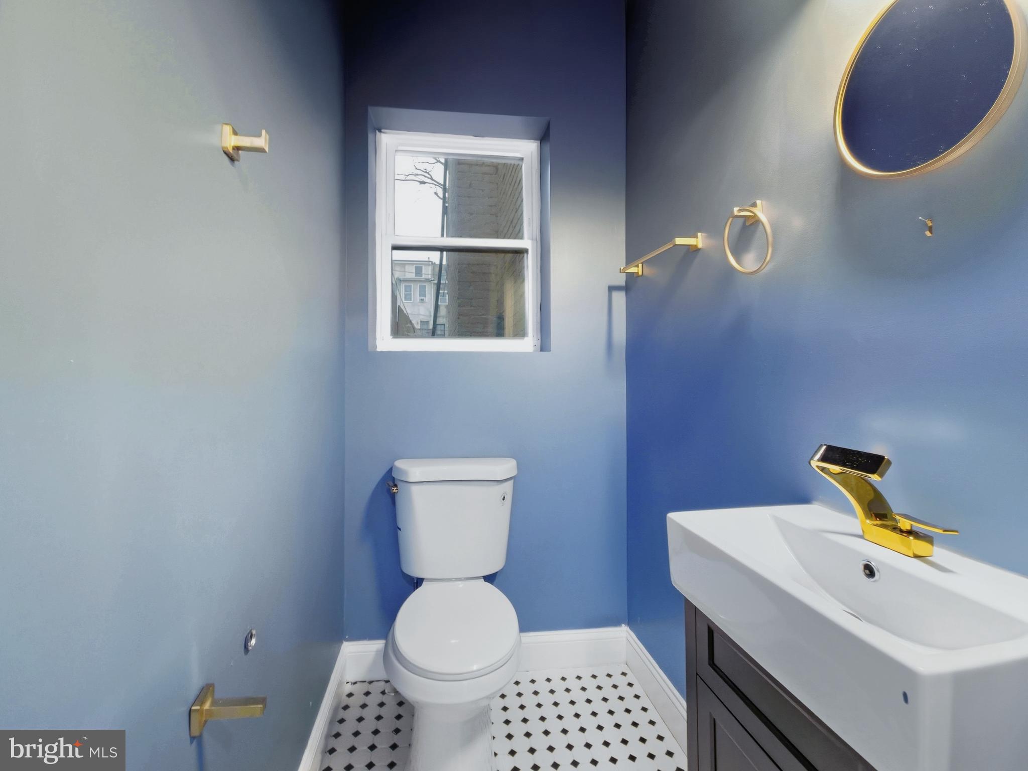 2321 McCulloh Street Baltimore, MD 21217 - Photo 10 of 29 a bathroom with a toilet and a sink