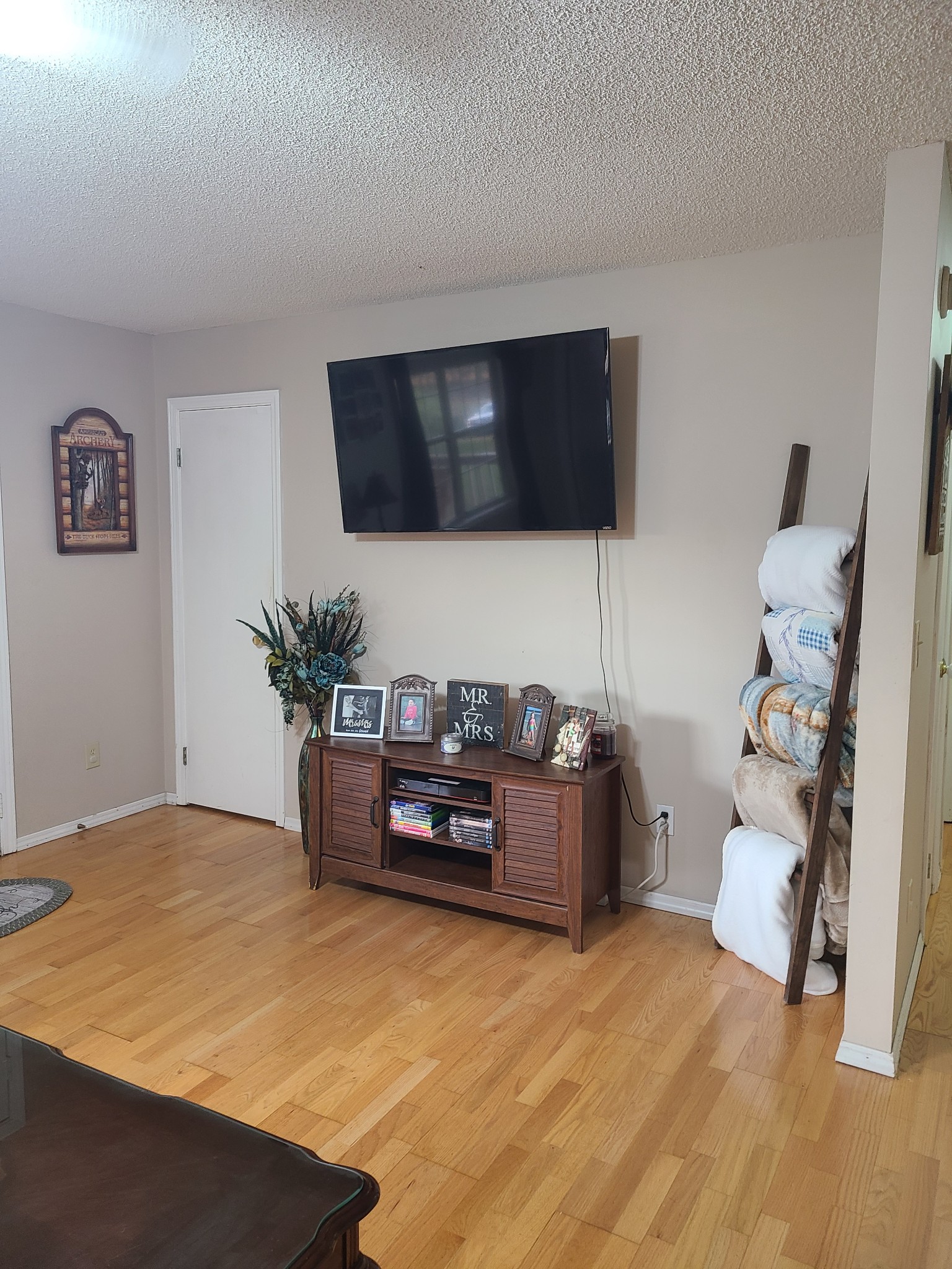1800 Bee Spring Road Dellrose, TN 38453 - Photo 13 of 21 a living room with furniture and a flat screen tv