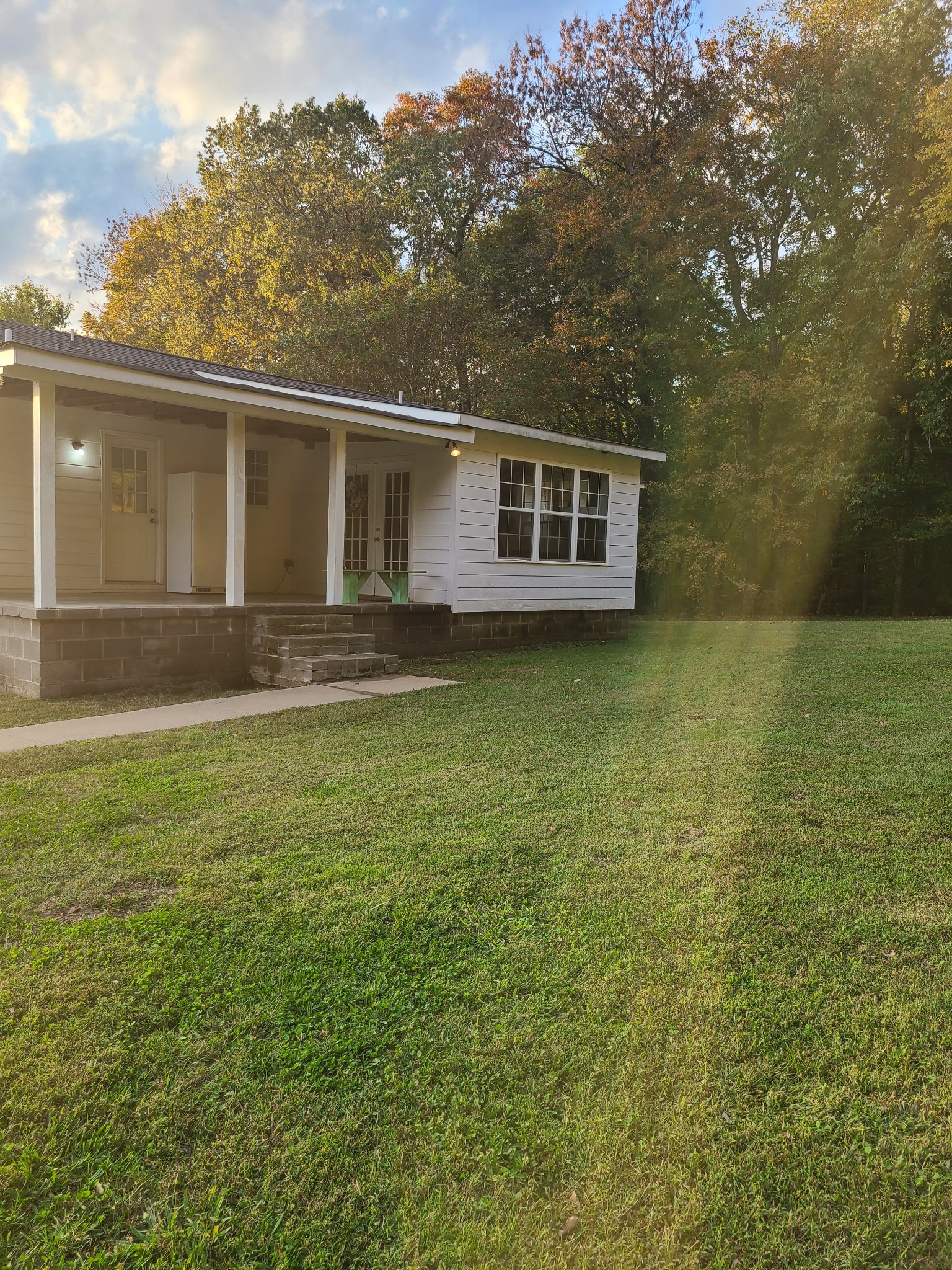 1800 Bee Spring Road Dellrose, TN 38453 - Photo 5 of 21 a front view of a house with garden