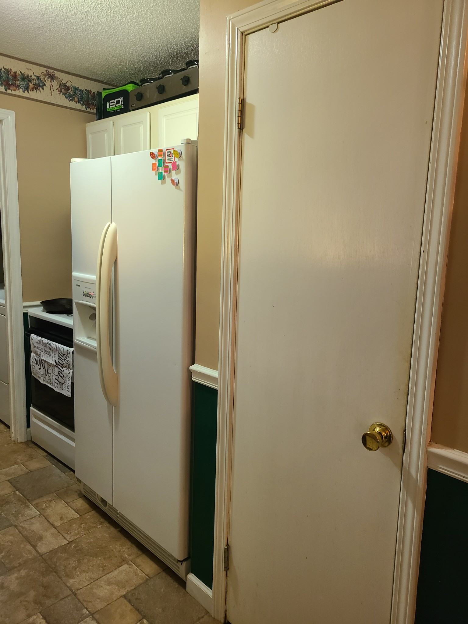 1800 Bee Spring Road Dellrose, TN 38453 - Photo 10 of 21 a white refrigerator freezer and a stove sitting inside of a kitchen