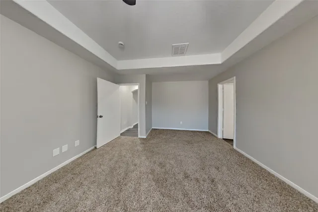a view of an empty room and closet area