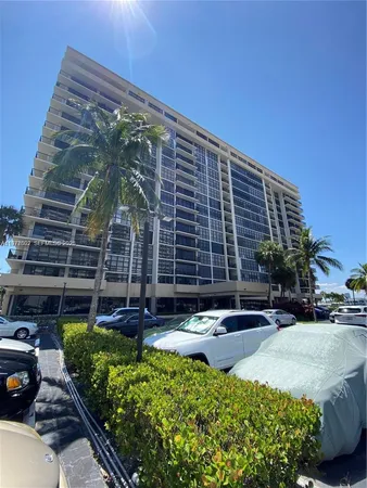 a front view of a building with garden