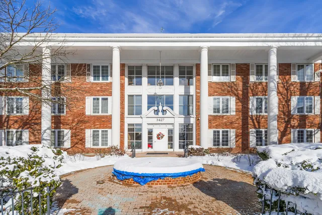 a front view of a house with a swimming pool