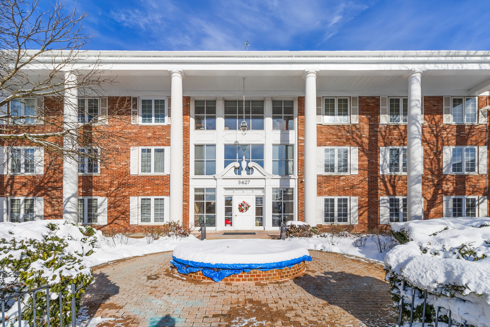 a front view of a house with a swimming pool