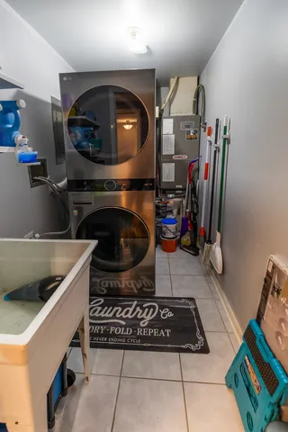 a kitchen with a sink a stove and cabinets
