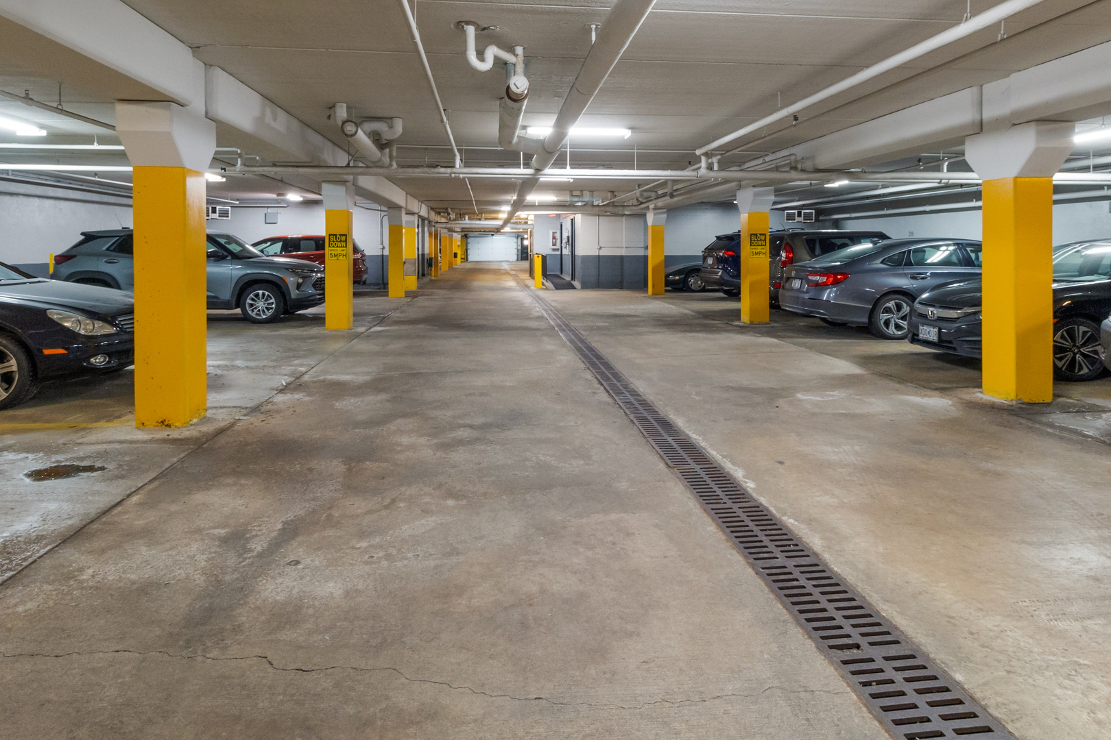 3427 Vollmer Road, Unit 205 Flossmoor, IL 60422 - Photo 27 of 28 a view of parking garage with cars