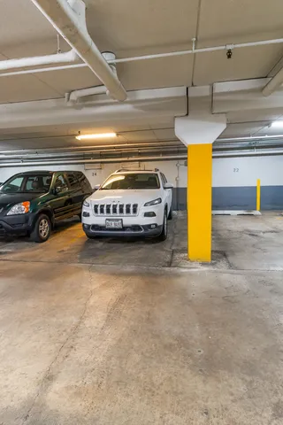 a view of a garage with a car parked