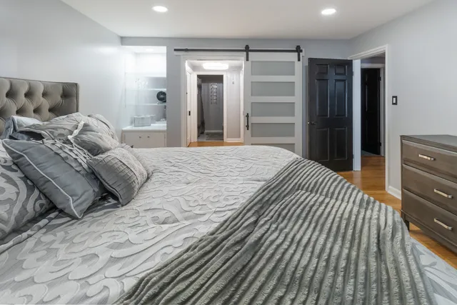 a bedroom with a bed and a walk in closet