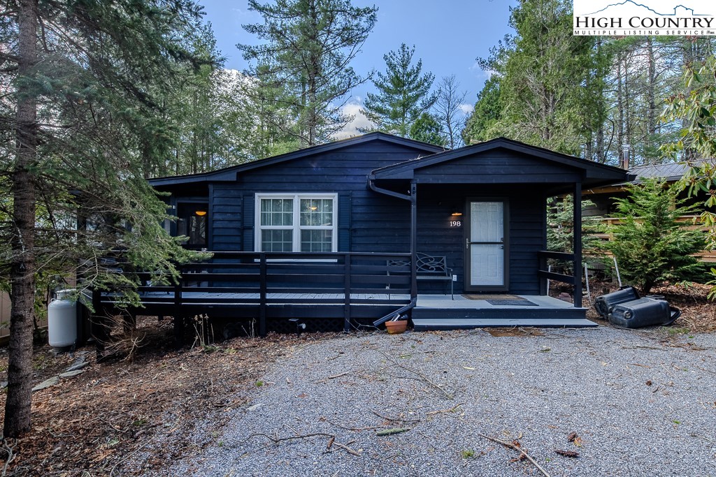 198 Black Pine Road Newland, NC 28657 - Photo 2 of 34 a front view of a house with a garden