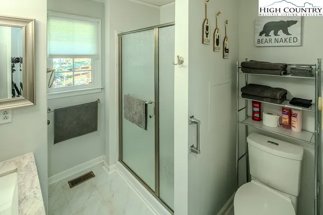 a bathroom with a sink a mirror and bathtub