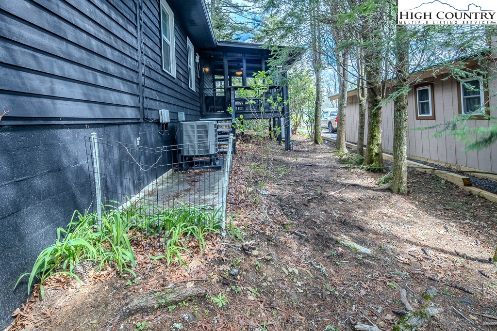 198 Black Pine Road Newland, NC 28657 - Photo 30 of 34 a backyard of a house with lots of green space