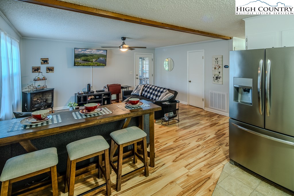 198 Black Pine Road Newland, NC 28657 - Photo 5 of 34 a kitchen with a dining table and chairs